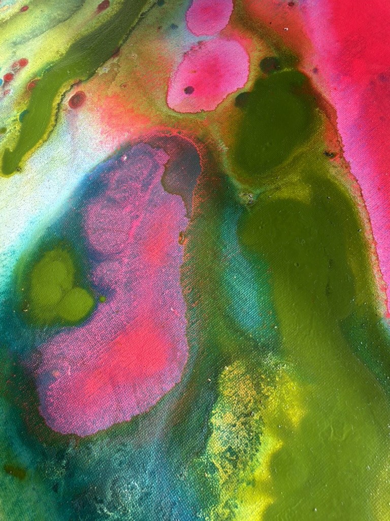 Close detail of a study: a magenta pool ringed in blue inside olive green, with hot pink above.