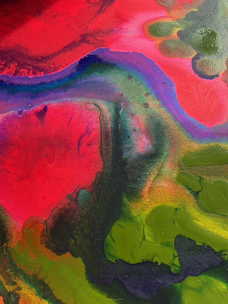Close detail of a study: a blue and violet river cutting through red, with green pooling below.